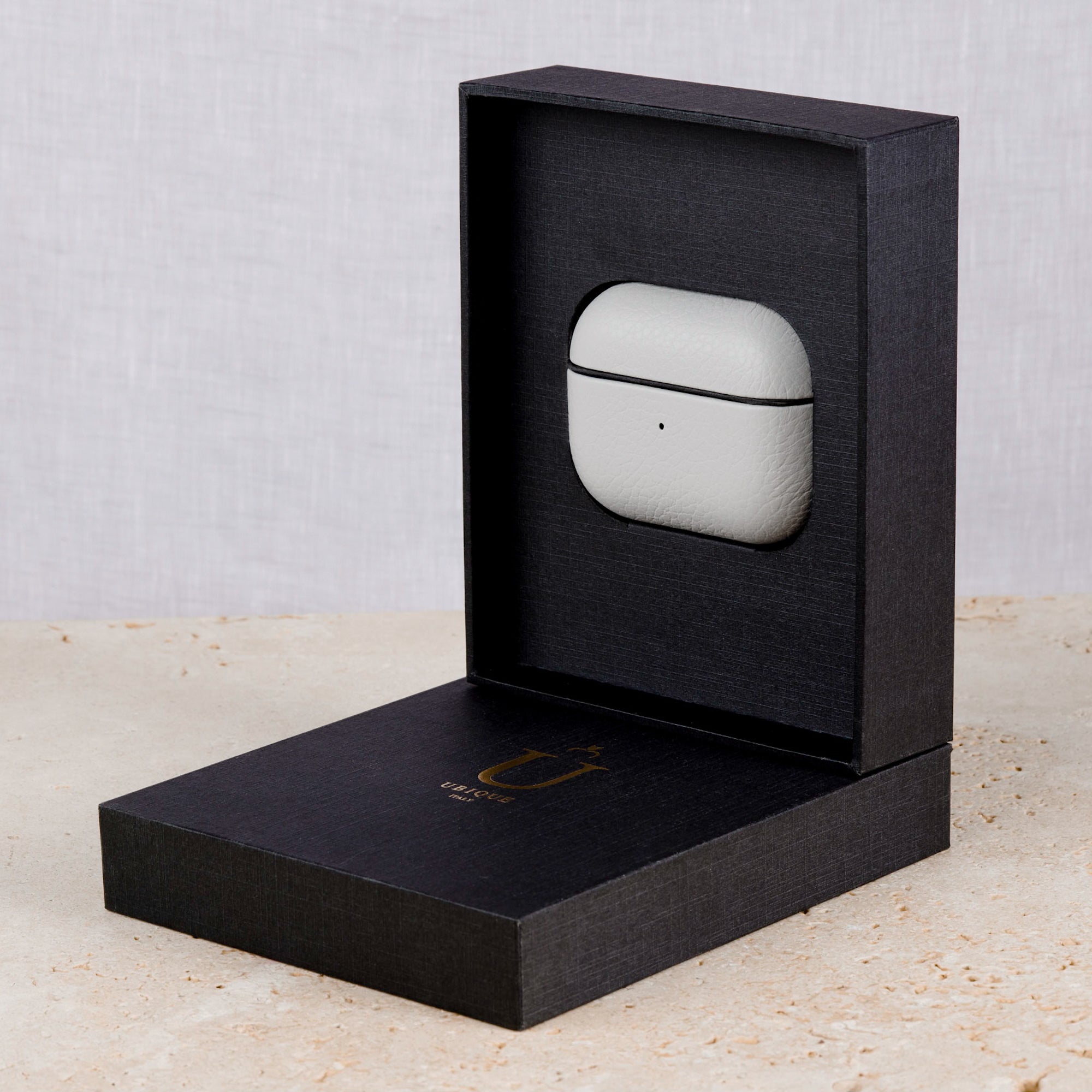 Ubique Italy Luxury AirPods Pro 2 Case Pebble Grain Leather Venetian Grey in dark grey box