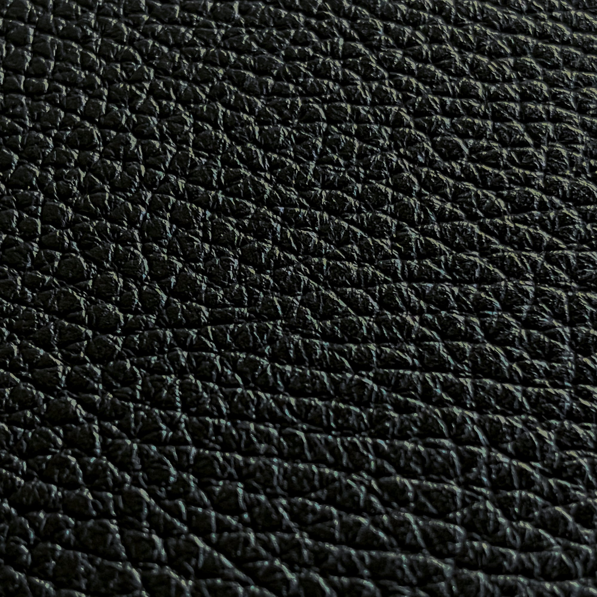close up of black full grain leather pebble grain