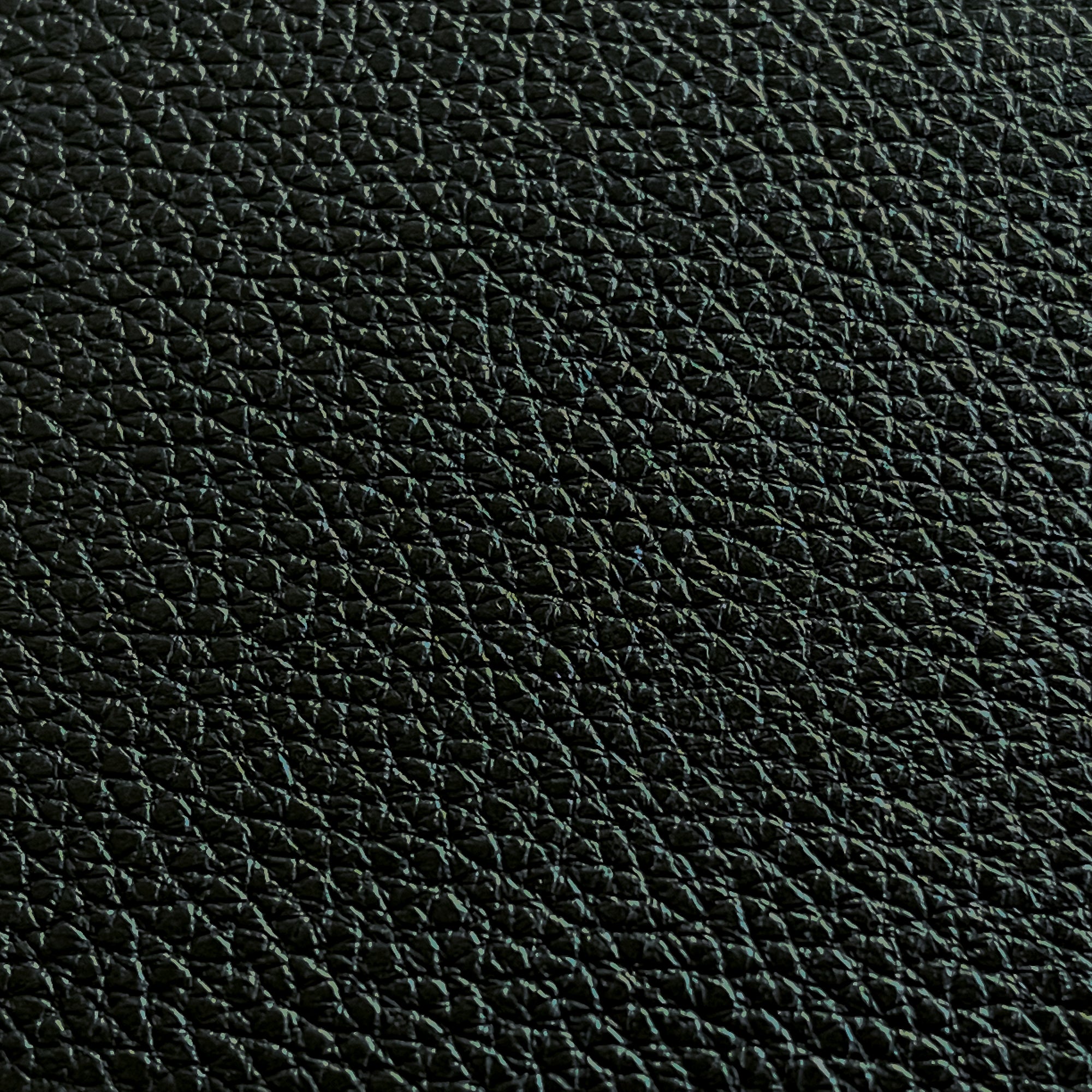 close up of black full grain leather pebble grain