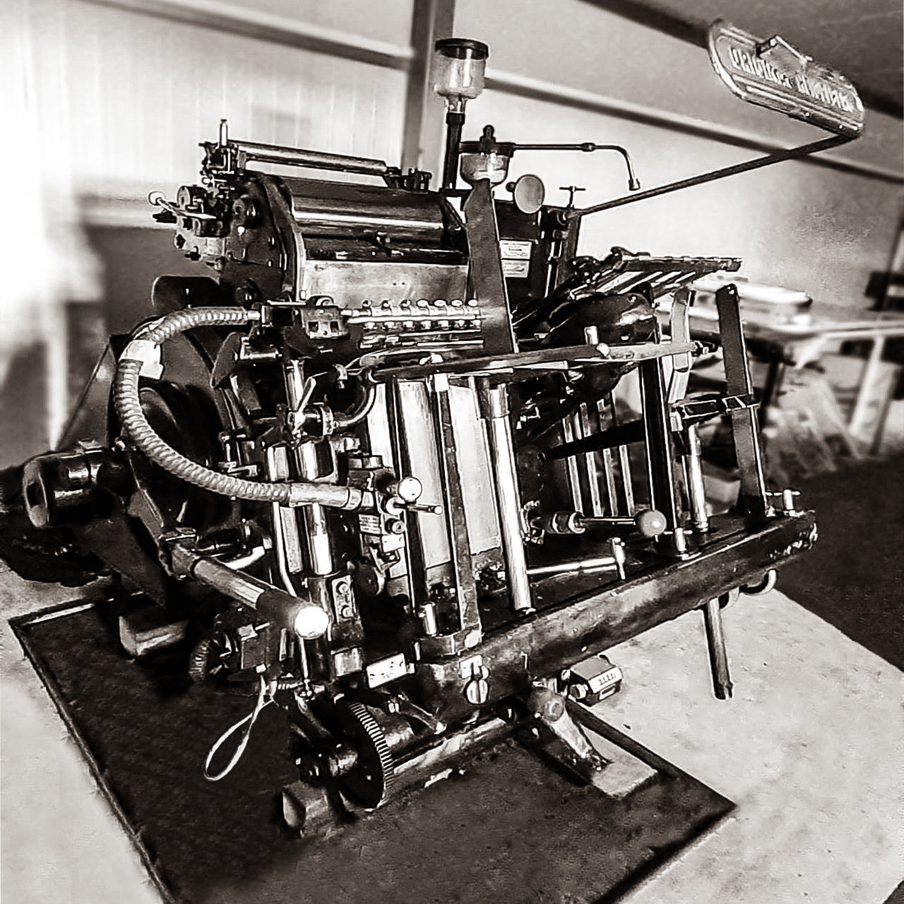 Old letter press machine in black and white
